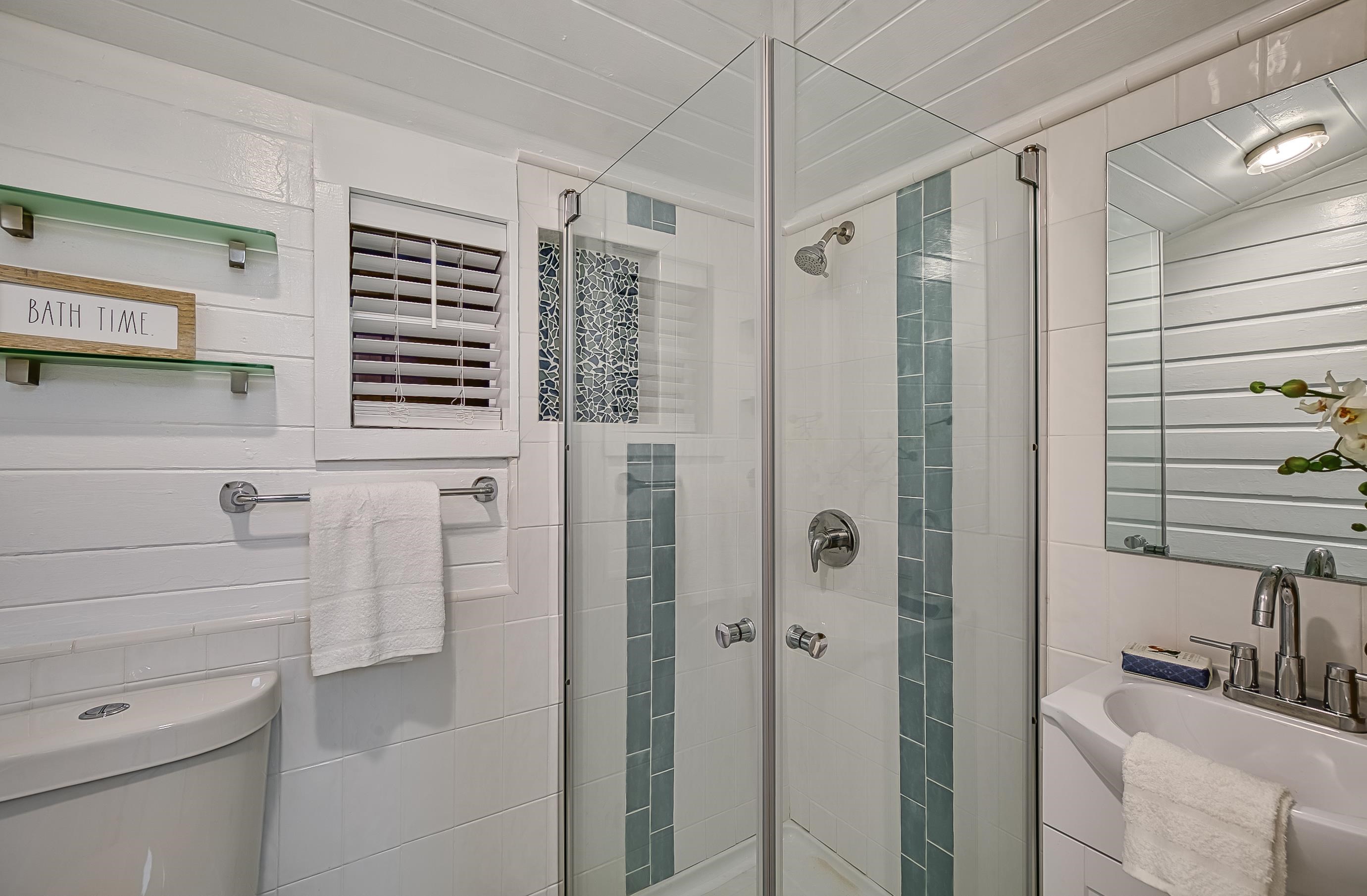 37 Phillips Street St. Augustine, FL 32084 - Photo 21 of 26 a bathroom with a shower a sink and a mirror