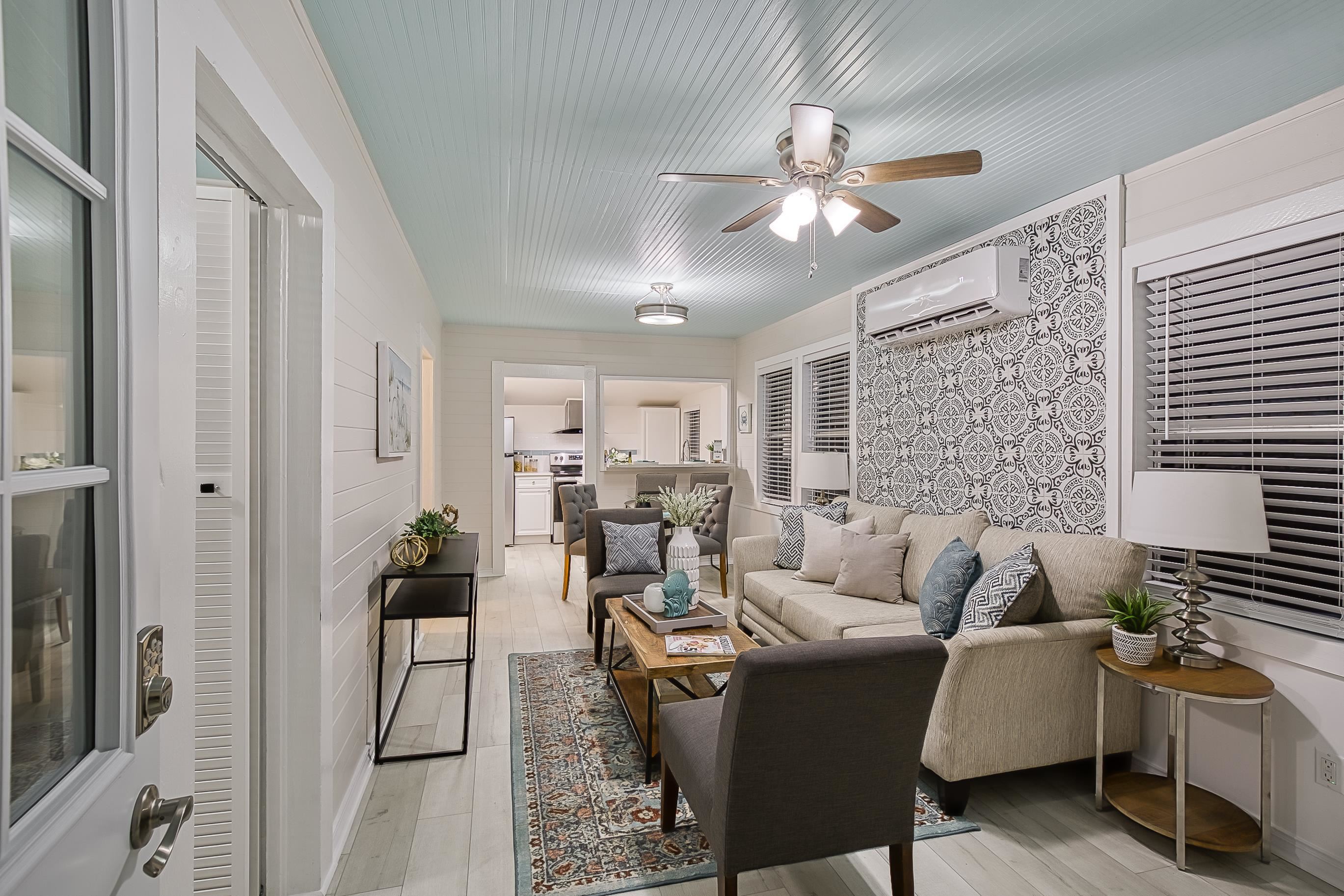 37 Phillips Street St. Augustine, FL 32084 - Photo 5 of 26 a living room with furniture and a chandelier