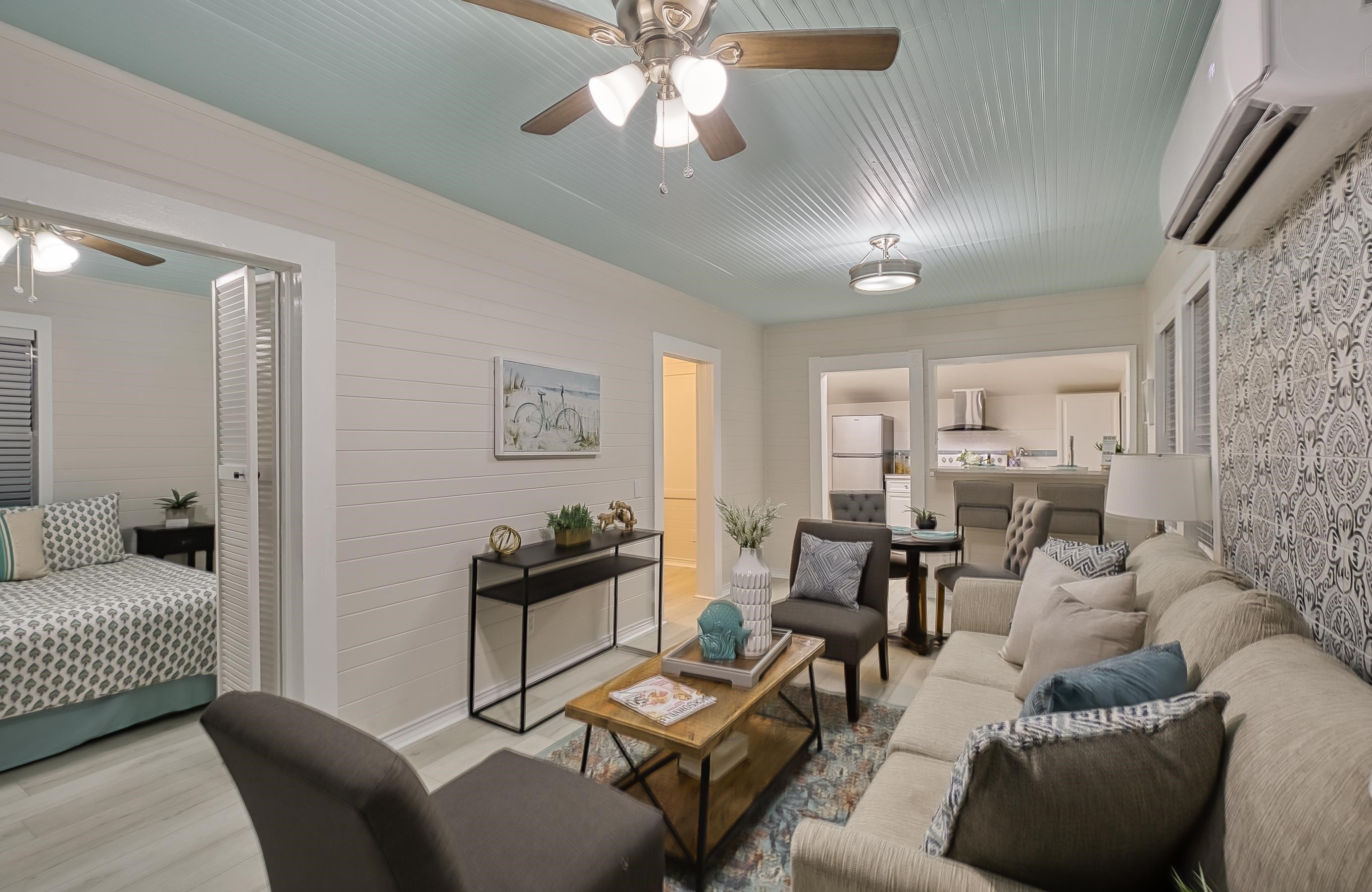 37 Phillips Street St. Augustine, FL 32084 - Photo 7 of 26 a living room with furniture and a chandelier