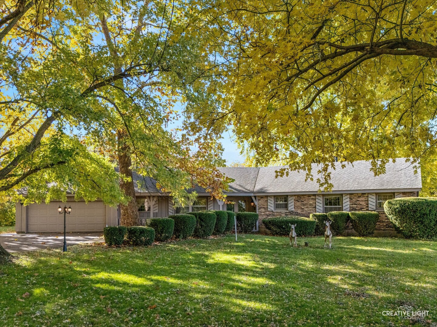 a view of a house with a yard porch and sitting area