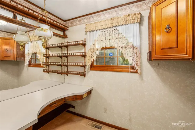 a view of room with stairs and mirrors