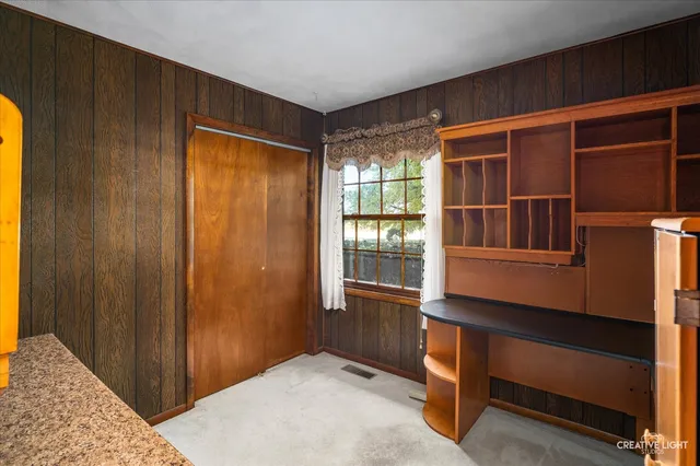 a room that has a dresser and a window