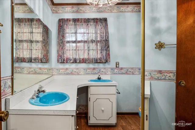 a bathroom with a sink a toilet and a tub