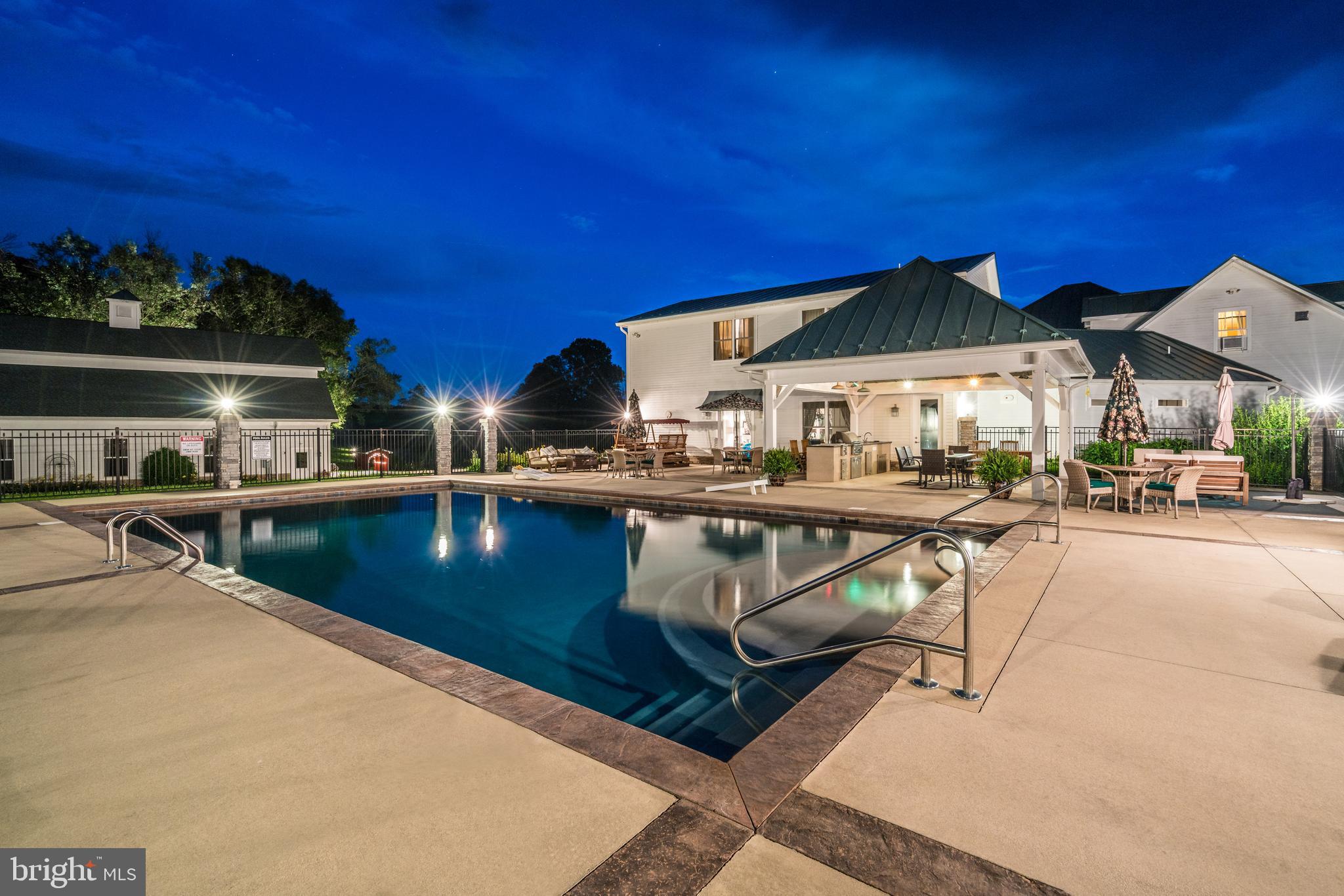 17440 True Blue Lane Reva, VA 22735 - Photo 2 of 75 a view of a patio with swimming pool table and chairs