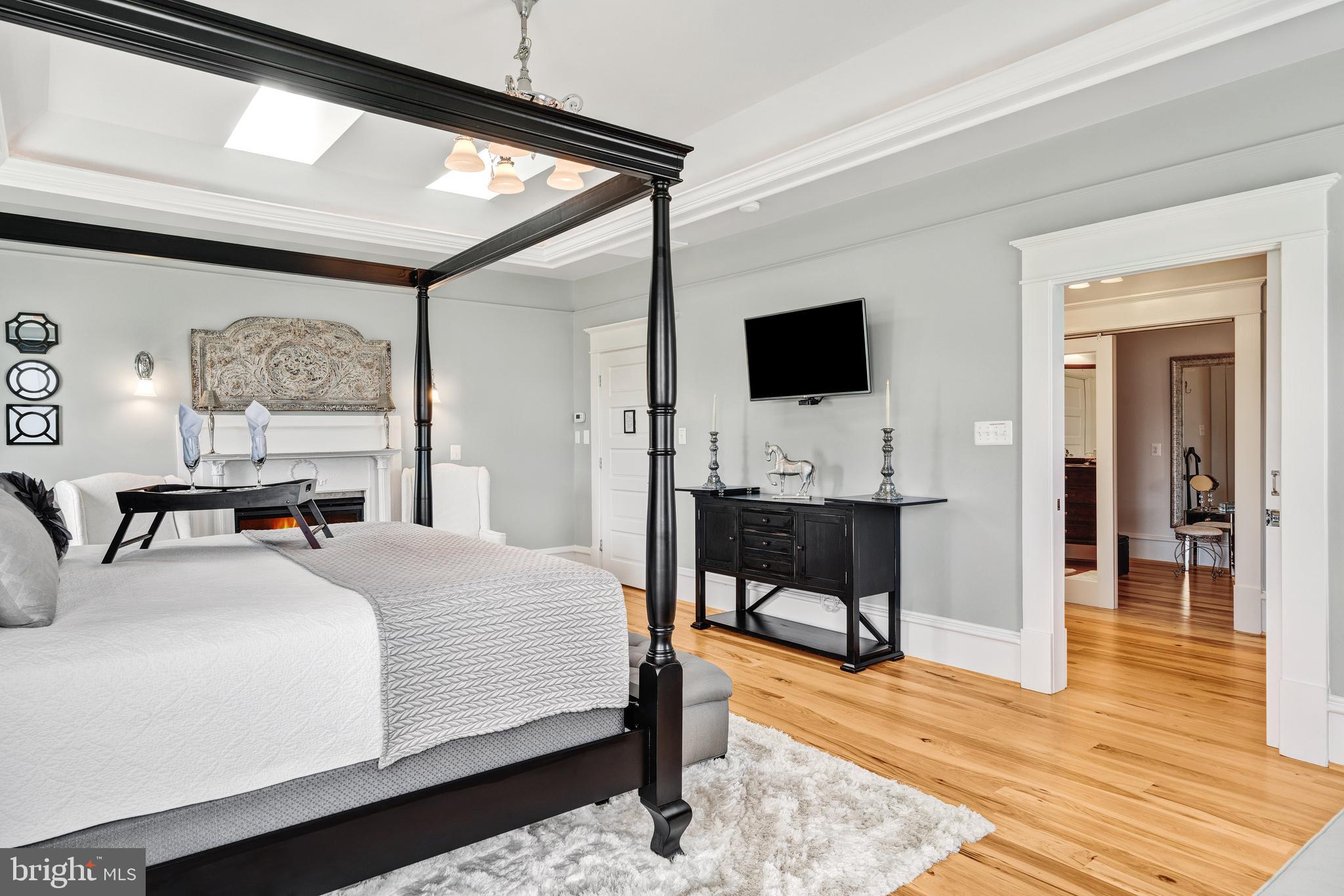 17440 True Blue Lane Reva, VA 22735 - Photo 29 of 75 a bedroom with a bed and a flat screen tv