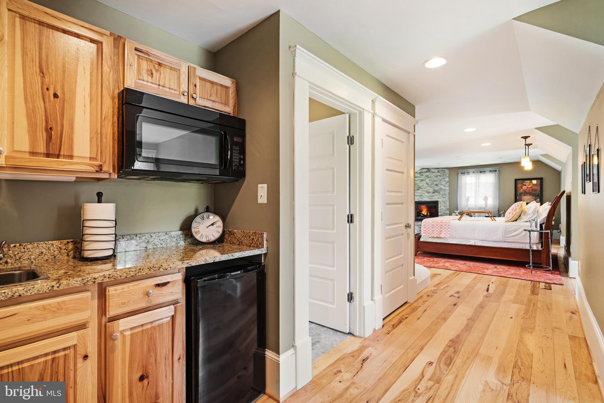17440 True Blue Lane Reva, VA 22735 - Photo 36 of 75 a bedroom with a bed and a flat screen tv