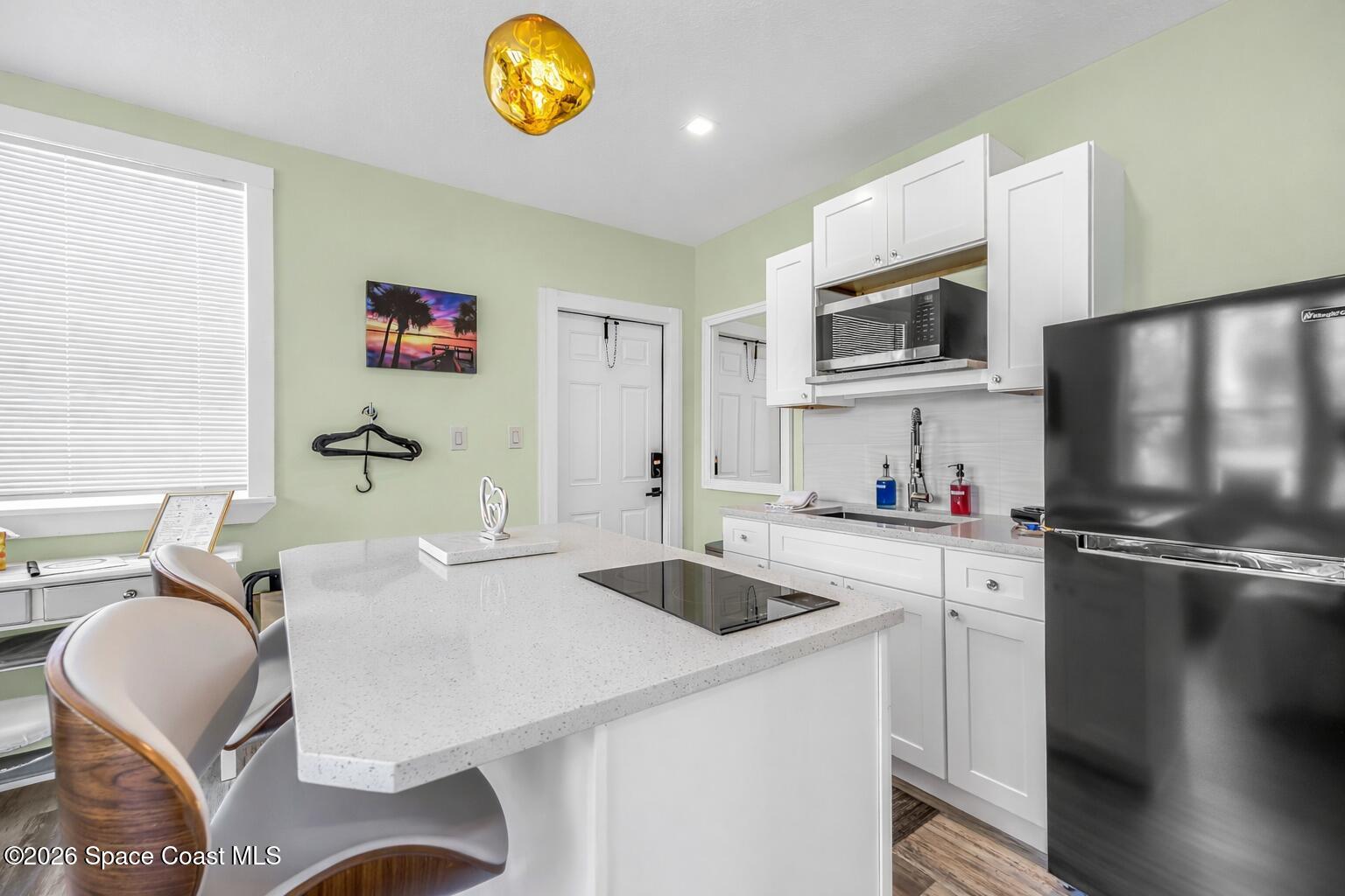 130 Valencia Road Rockledge, FL 32955 - Photo 64 of 72 Modern Kitchen with Built-In Cooktop