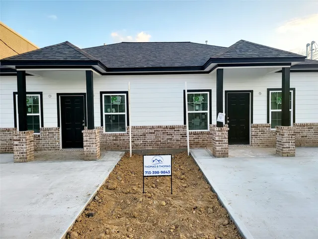 front view of a house with a large window