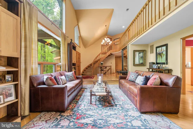 a kitchen with stainless steel appliances granite countertop lots of counter top space and furniture