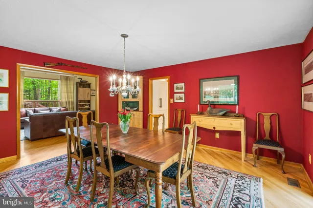 a bathroom with a sink mirror and toilet