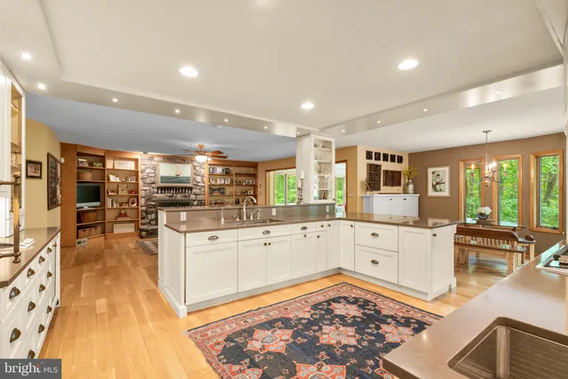 a bathroom with a sink mirror vanity and toilet