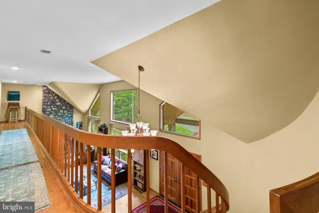 a bathroom with a granite countertop double vanity sink and a mirror