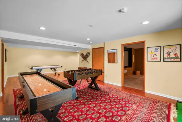 a bathroom with a sink mirror and toilet