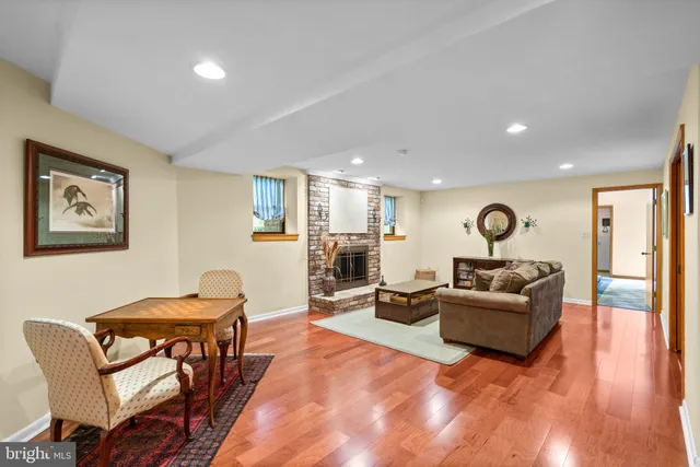 an aerial view of residential house with outdoor space and trees all around