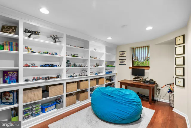 an aerial view of residential house with outdoor space and trees all around