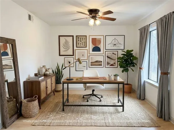 a view of living room with furniture and window