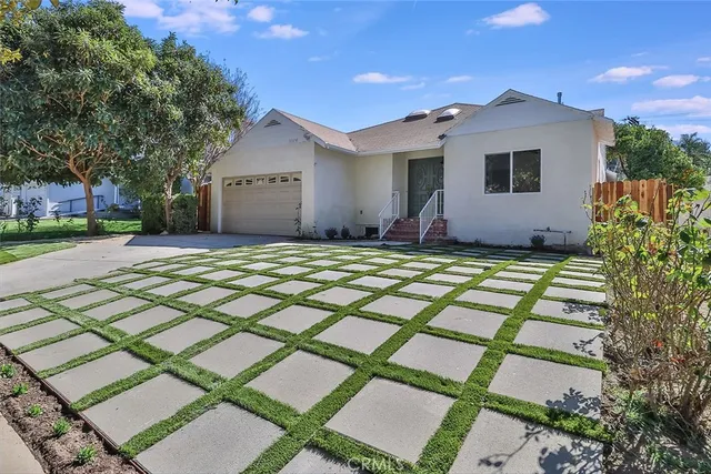 a house view with a backyard space