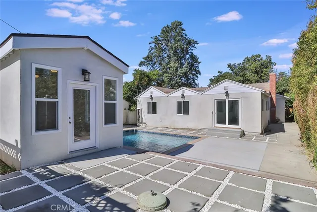 a white house with a large outdoor space