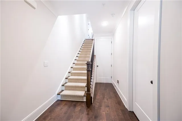 a kitchen with a refrigerator a sink and a stove top oven