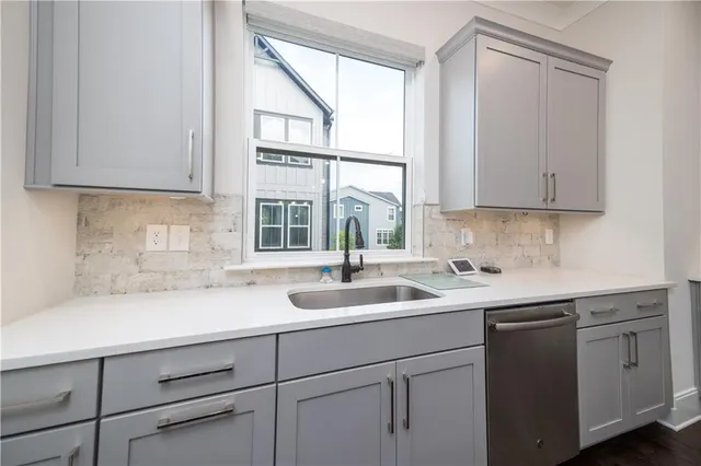 a kitchen with a stove and a sink