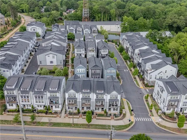 a bathroom with a sink toilet and a mirror