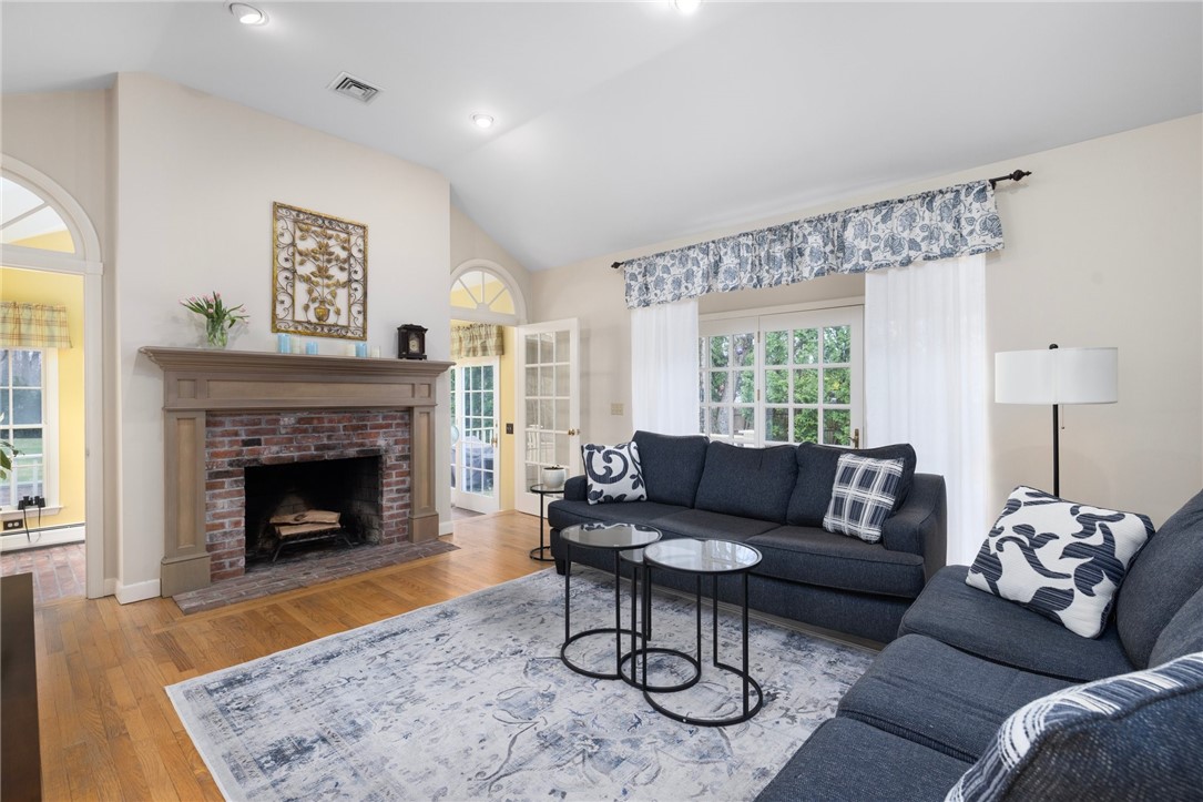 2 Lansdowne Road Warwick, RI 02888 - Photo 14 of 49 A vaulted ceiling and a wood burning fireplace create a lovely feeling in this amazing space.