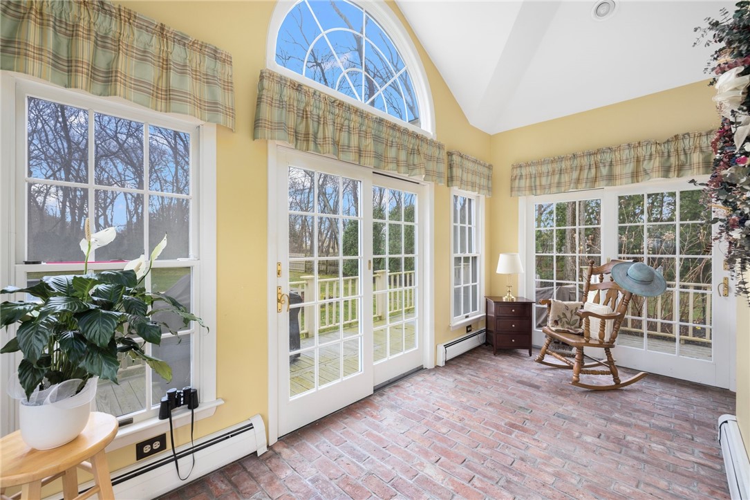2 Lansdowne Road Warwick, RI 02888 - Photo 17 of 49 Another perspective of the beautiful sunroom. This amazing space showcases gorgeous views of the yard.