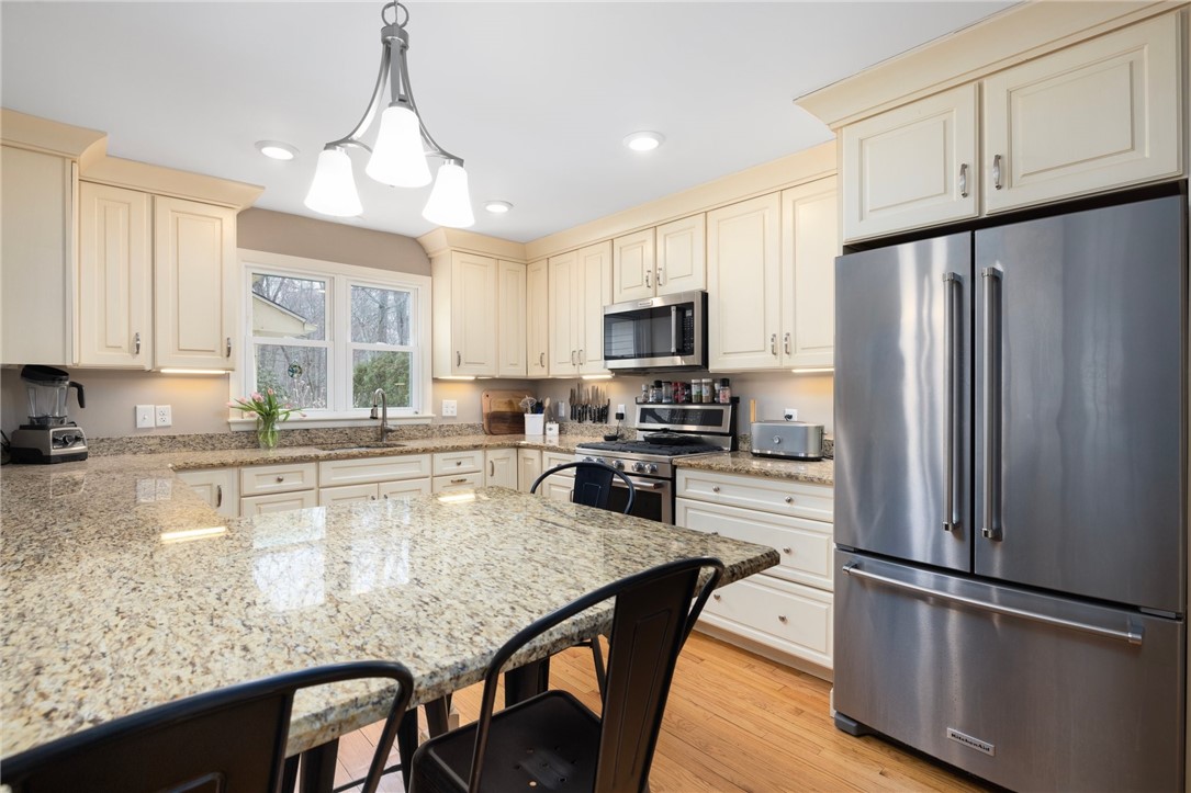 2 Lansdowne Road Warwick, RI 02888 - Photo 5 of 49 This gorgeous, updated kitchen is neutral in color and offers an extended island for seating.