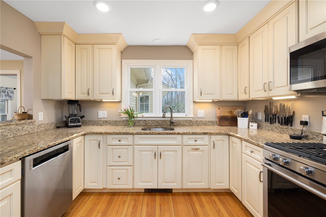 2 Lansdowne Road Warwick, RI 02888 - Photo 6 of 49 Ample storage and plenty of counter space. A window looks out to the back yard.