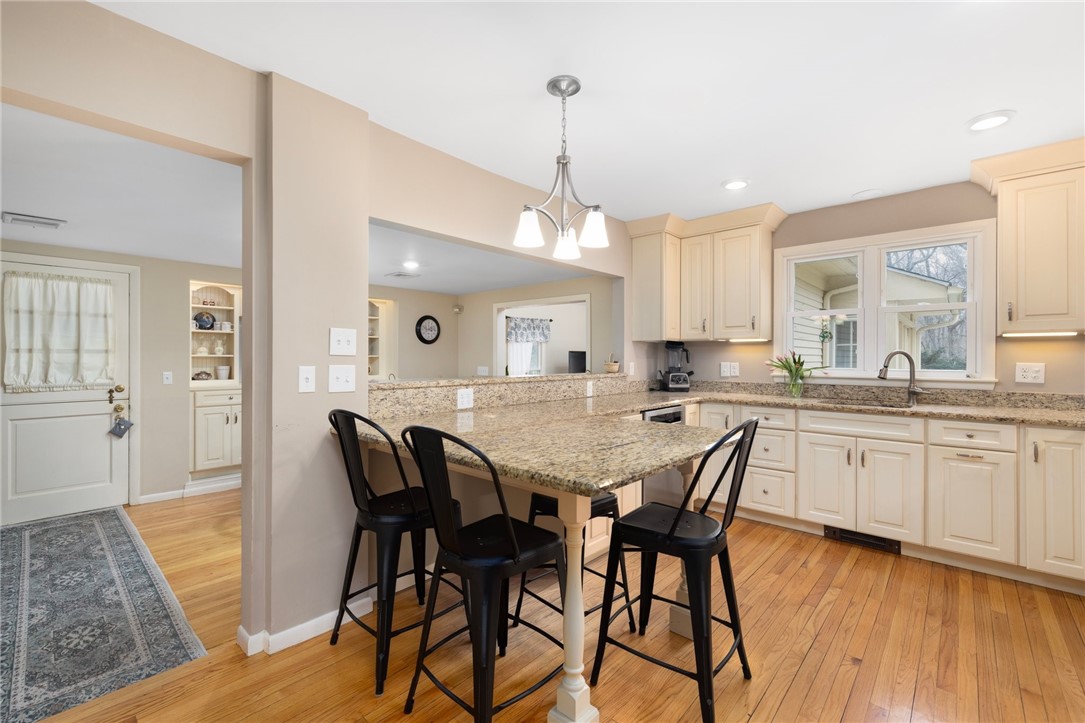 2 Lansdowne Road Warwick, RI 02888 - Photo 10 of 49 A large cutout overlooks a spacious dining area.