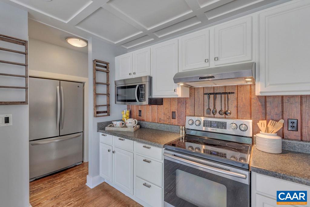 5668 Advance Mills Road Ruckersville, VA 22968 - Photo 16 of 56 a kitchen with stainless steel appliances granite countertop a refrigerator sink and stove