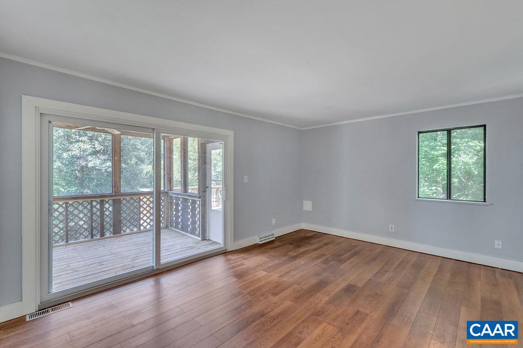 5668 Advance Mills Road Ruckersville, VA 22968 - Photo 20 of 56 wooden floor in an empty room with a window