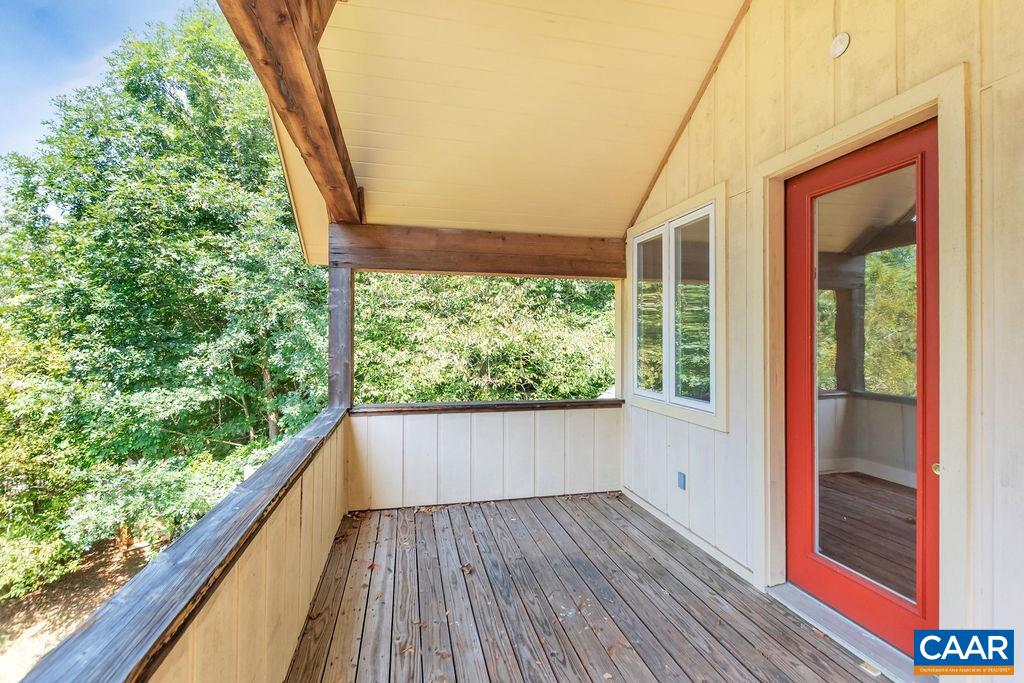 5668 Advance Mills Road Ruckersville, VA 22968 - Photo 32 of 56 a view of a room with wooden floor and large windows