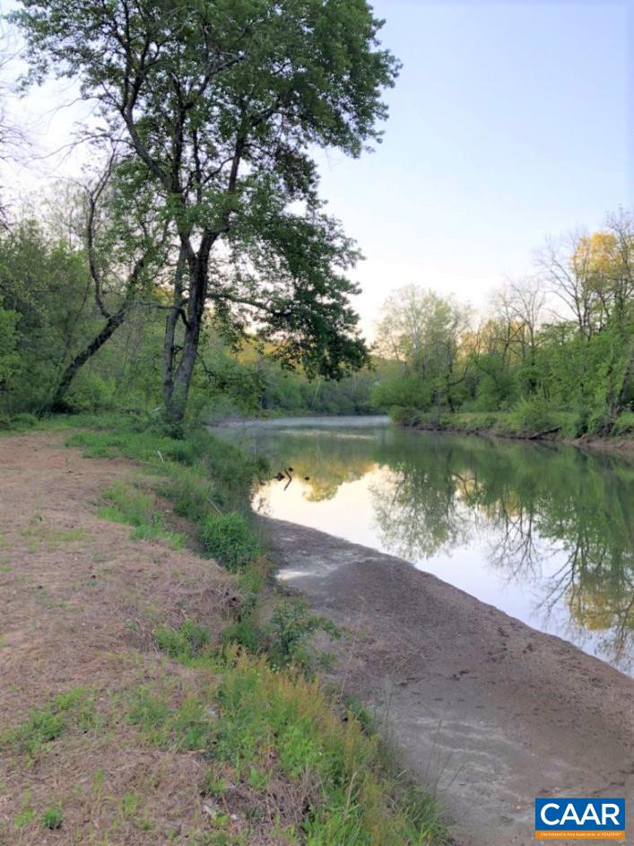 5668 Advance Mills Road Ruckersville, VA 22968 - Photo 4 of 56 a view of a lake with a yard