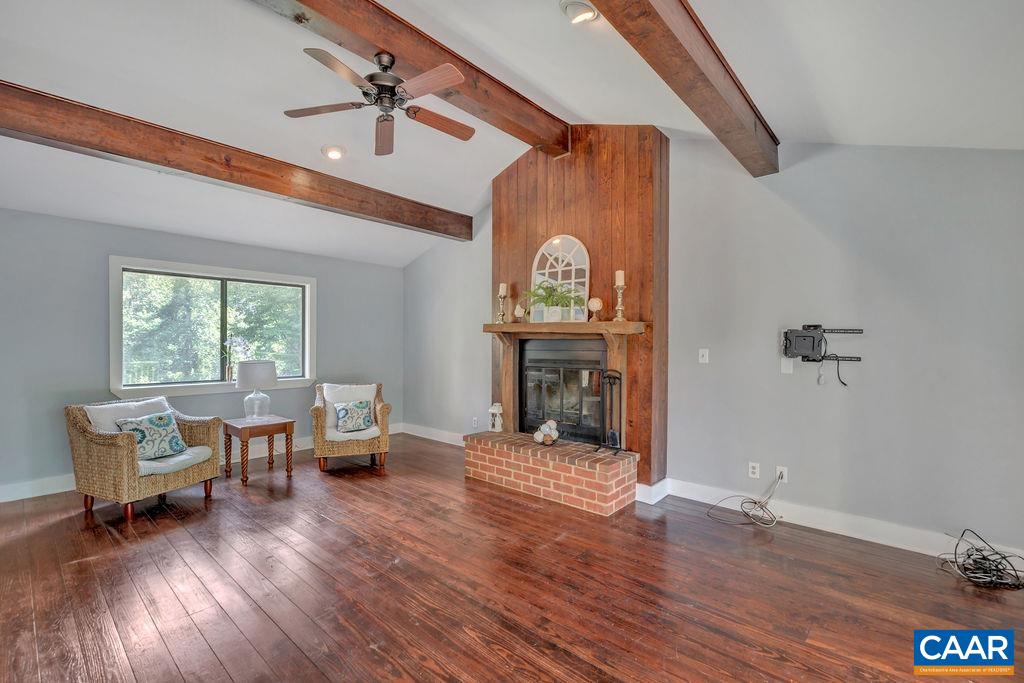 5668 Advance Mills Road Ruckersville, VA 22968 - Photo 10 of 56 a living room with furniture and a fireplace
