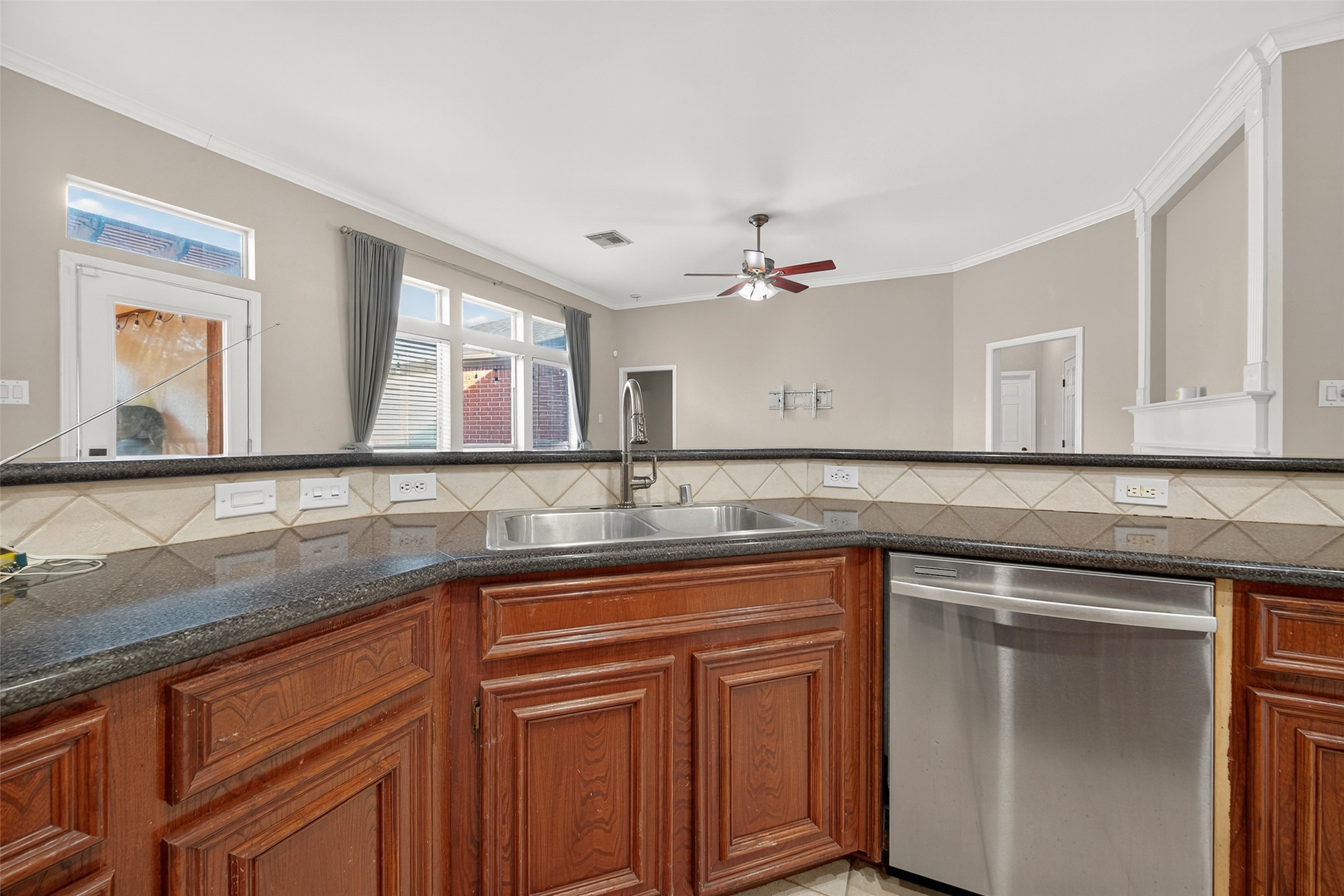 3131 Valley Court Manvel, TX 77578 - Photo 11 of 38 a kitchen with a sink and cabinets