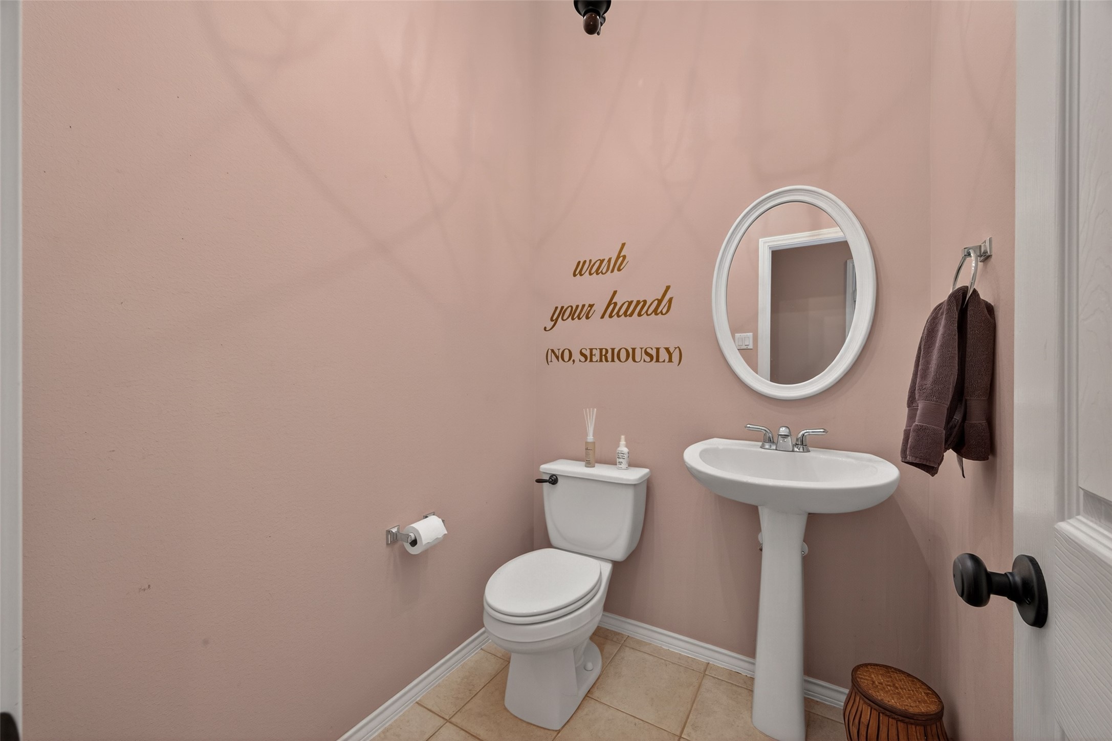 3131 Valley Court Manvel, TX 77578 - Photo 20 of 38 a bathroom with a toilet sink and mirror