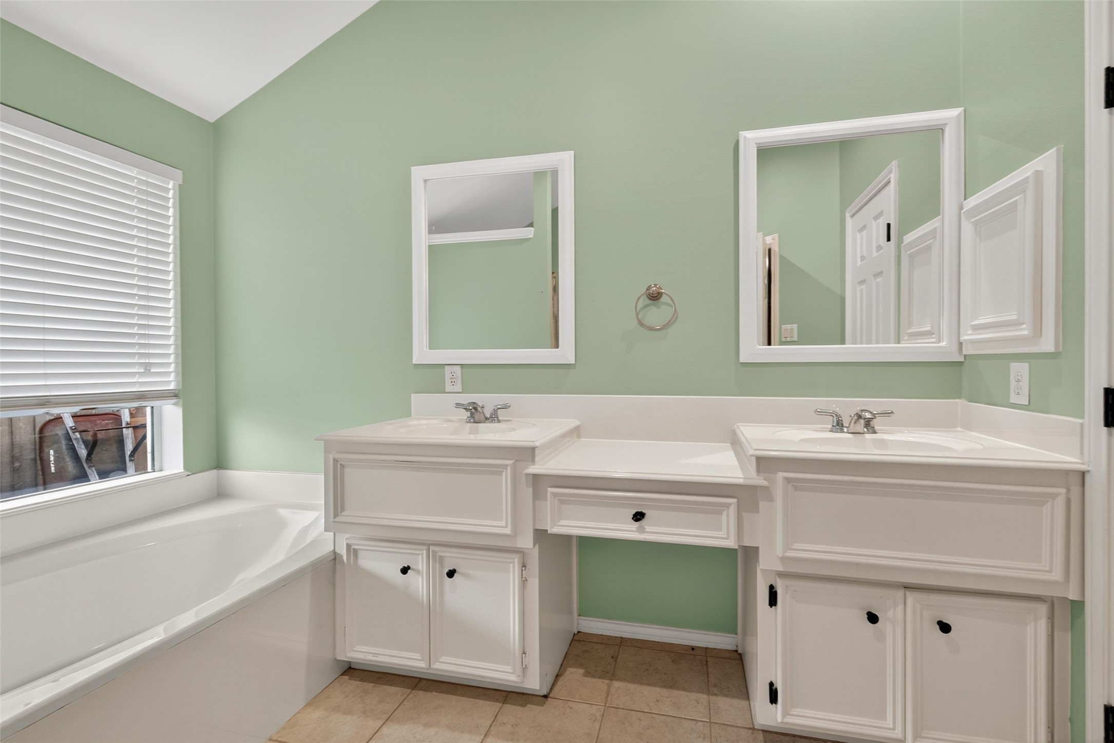 3131 Valley Court Manvel, TX 77578 - Photo 28 of 38 a bathroom with a sink vanity and mirror