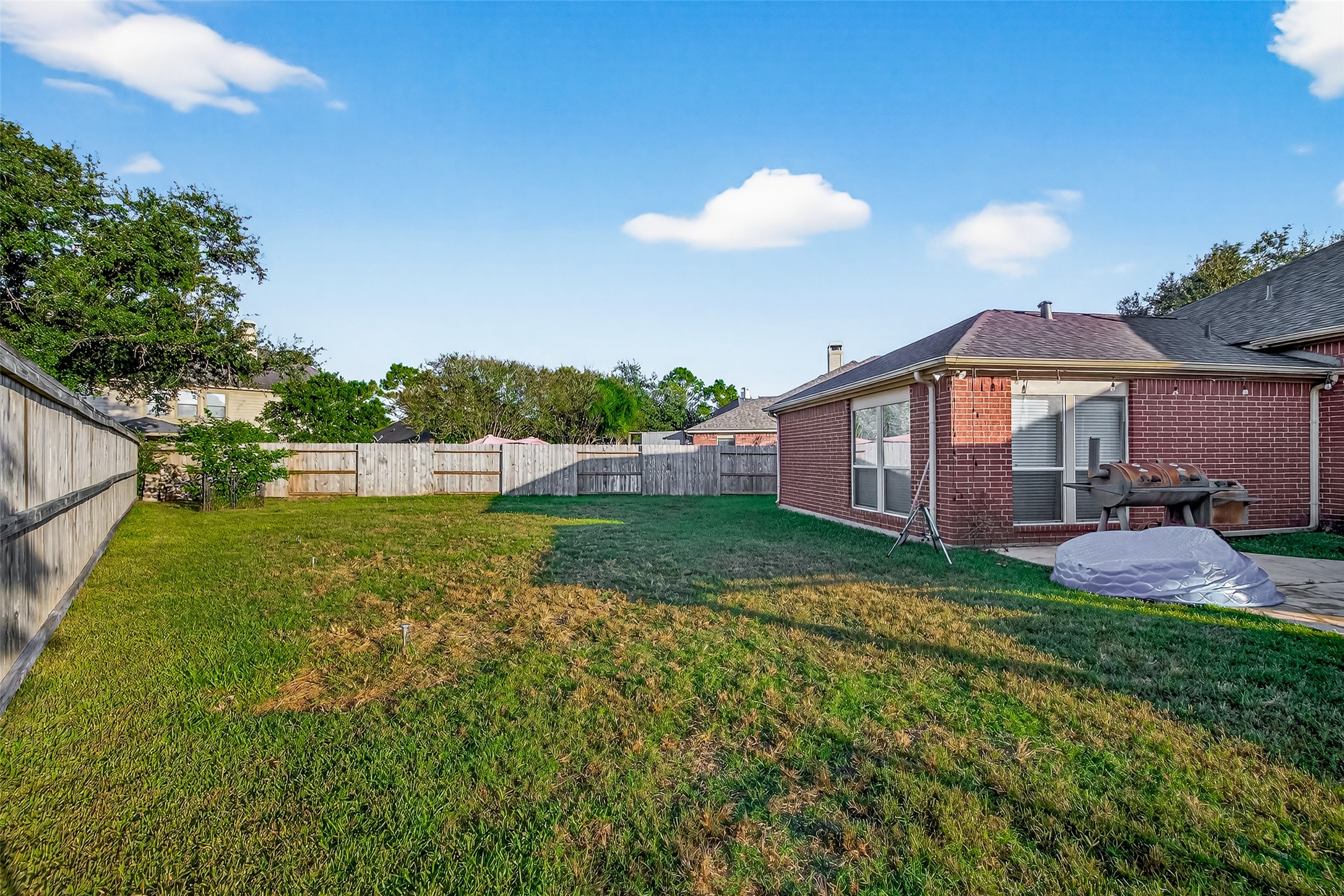 3131 Valley Court Manvel, TX 77578 - Photo 33 of 38 a view of a house with backyard and sitting area