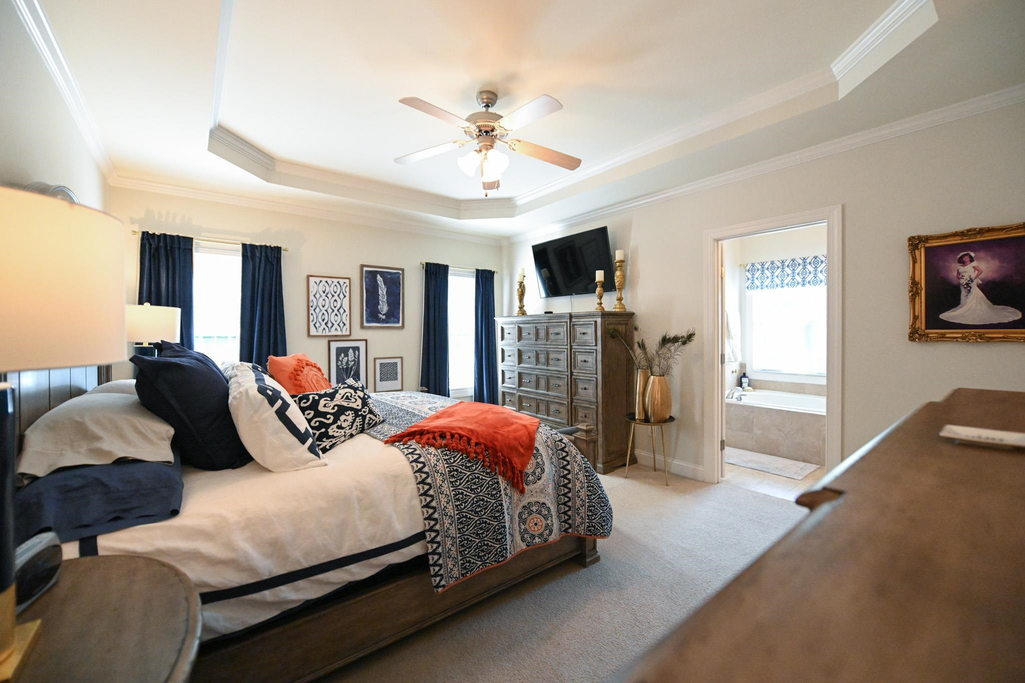 190 Pinecroft Drive Dunn, NC 28334 - Photo 18 of 51 a bedroom with a large bed and a chandelier