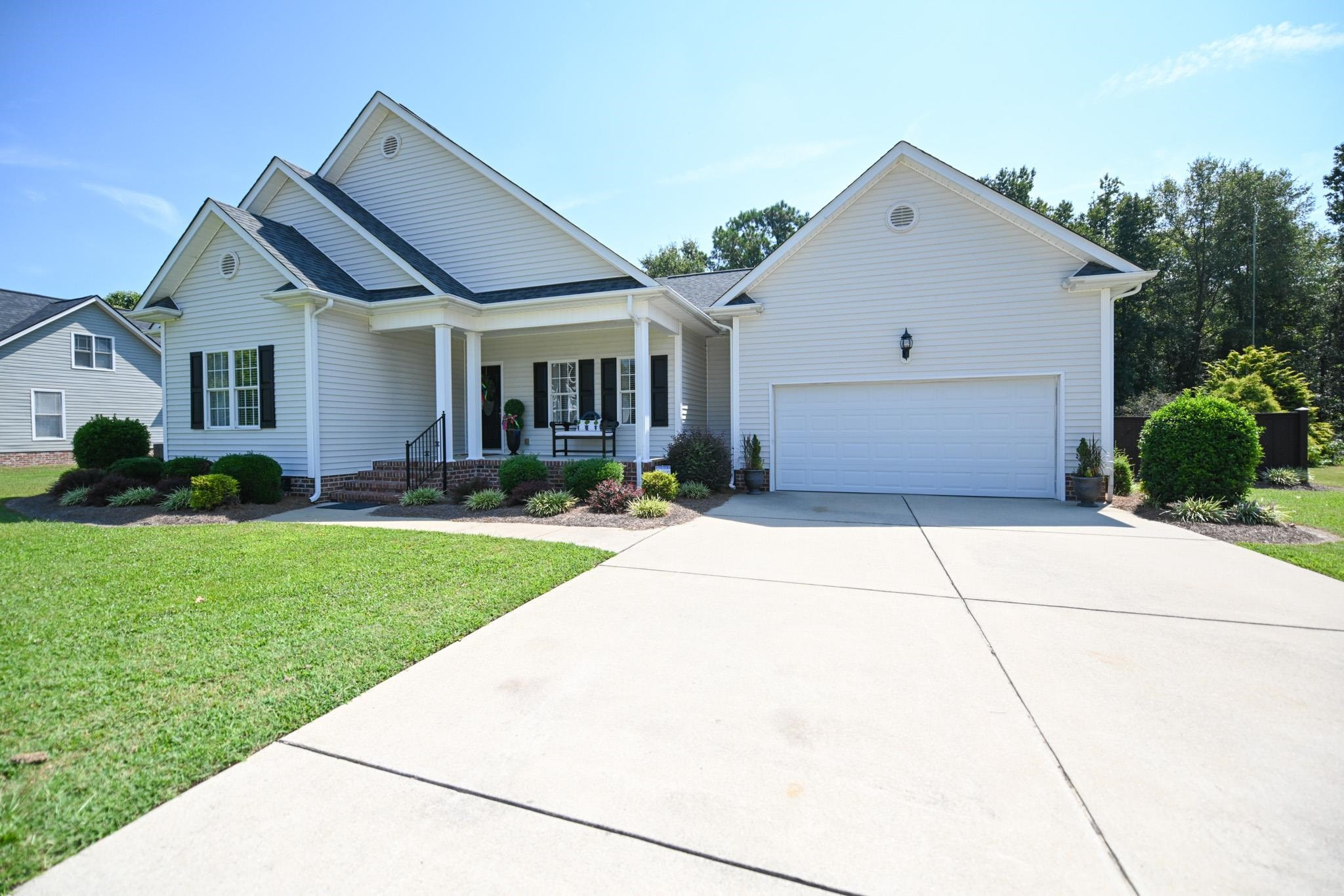 190 Pinecroft Drive Dunn, NC 28334 - Photo 2 of 51 a front view of a house with garden