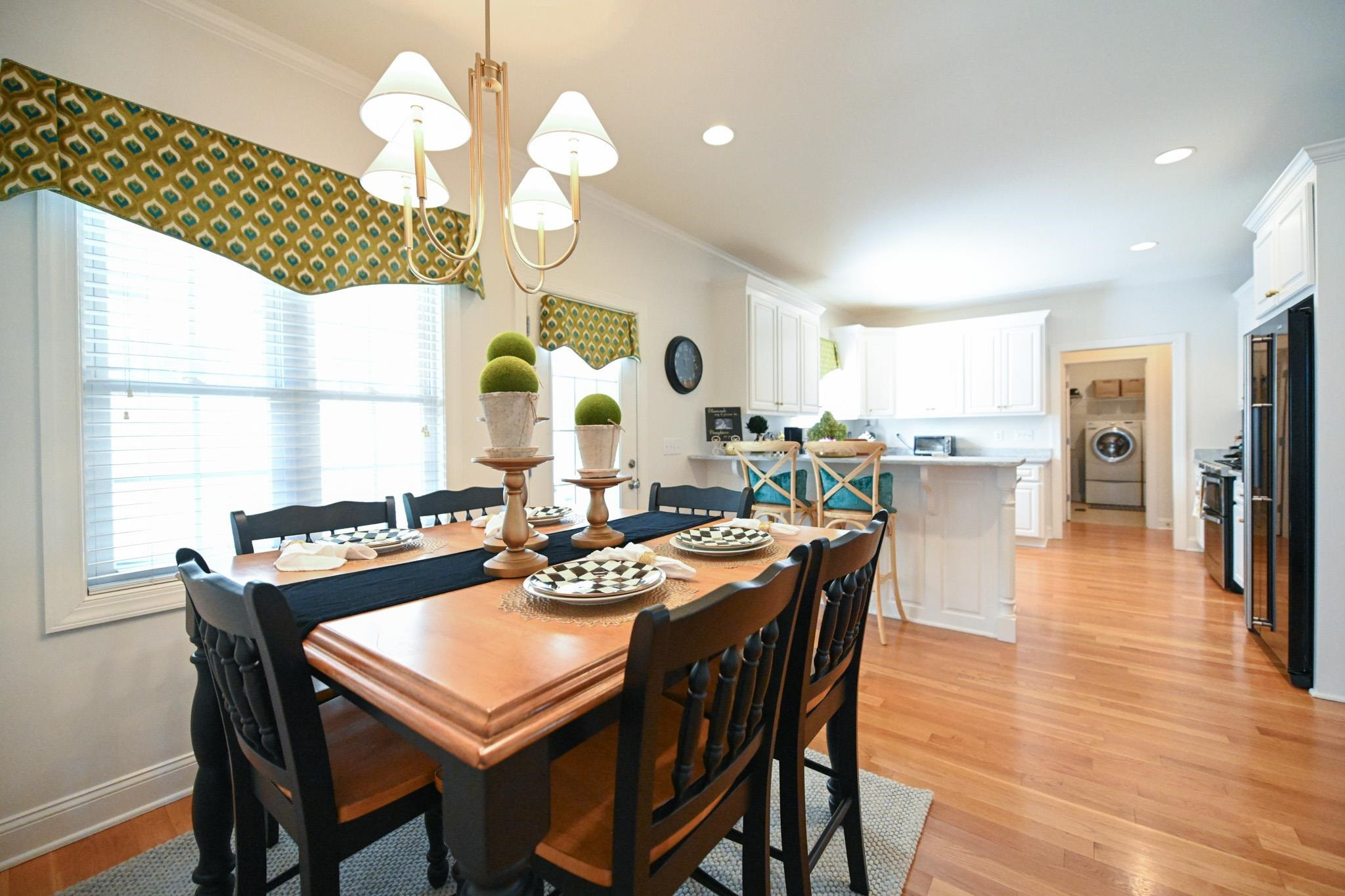 190 Pinecroft Drive Dunn, NC 28334 - Photo 28 of 51 a view of a dining room and a kitchen with a table chairs