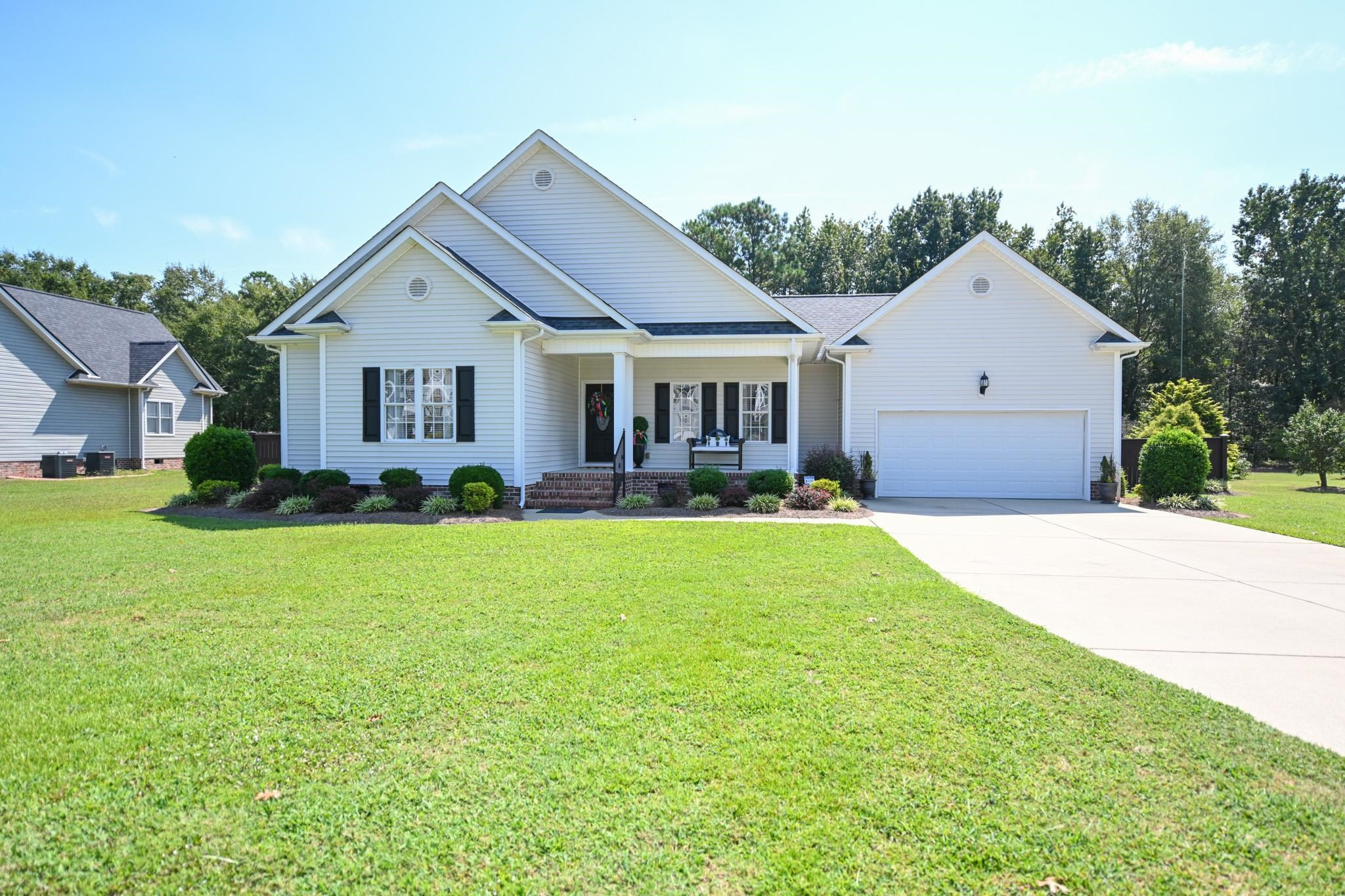 190 Pinecroft Drive Dunn, NC 28334 - Photo 3 of 51 a front view of a house with garden