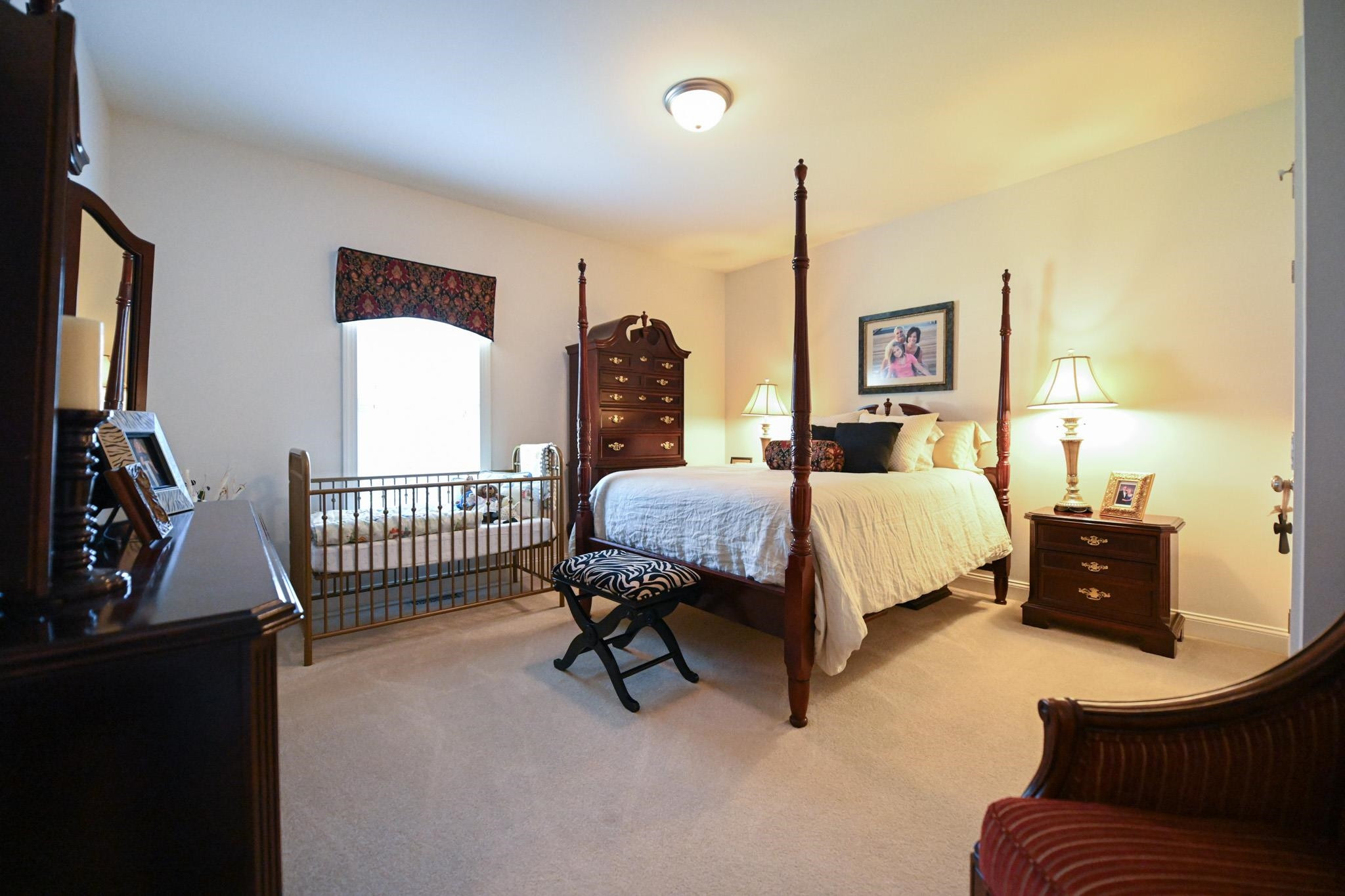190 Pinecroft Drive Dunn, NC 28334 - Photo 35 of 51 a bed room with a bed window and a flat tv screen on dresser
