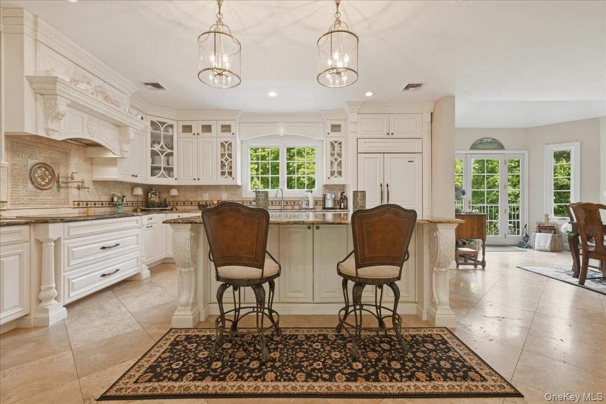 31 Cornwall Lane Sands Point, NY 11050 - Photo 17 of 49 a view of a dining room with furniture and wooden floor
