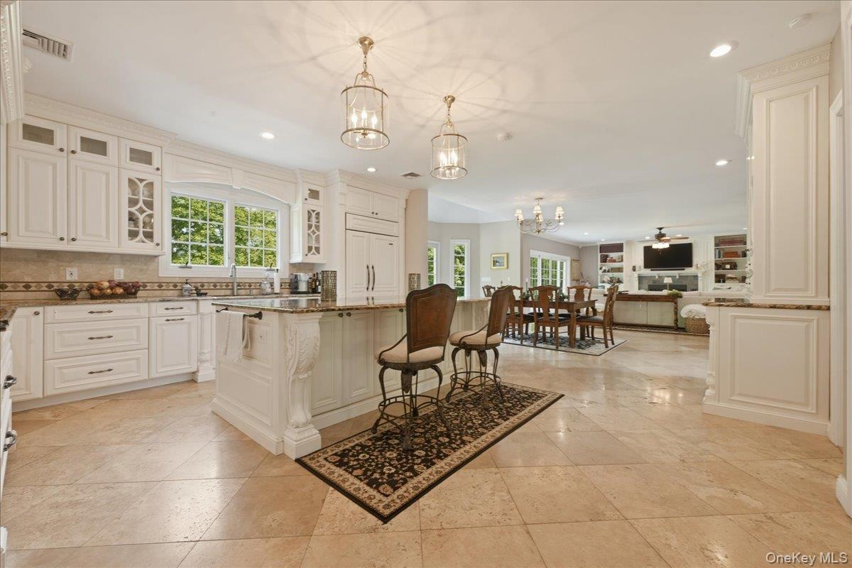 31 Cornwall Lane Sands Point, NY 11050 - Photo 18 of 49 a large white kitchen with cabinets