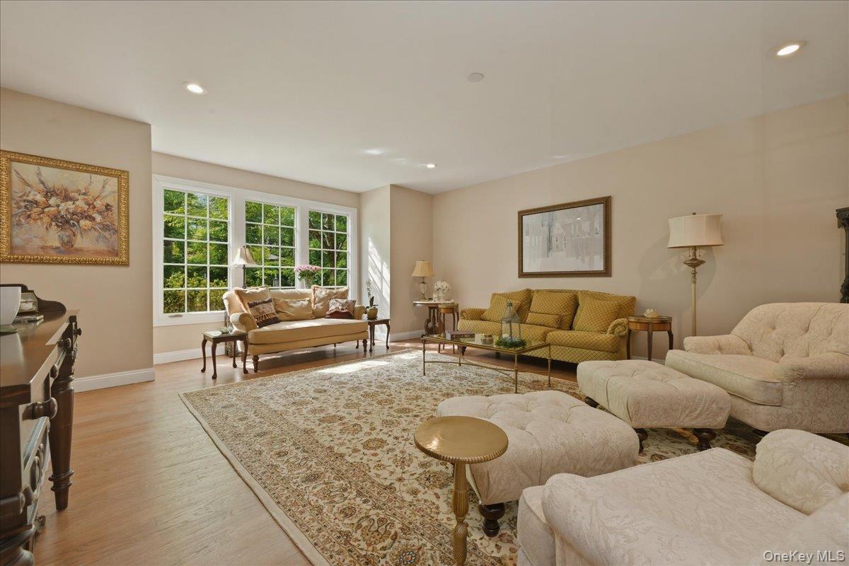 31 Cornwall Lane Sands Point, NY 11050 - Photo 22 of 49 a living room with furniture and a large window