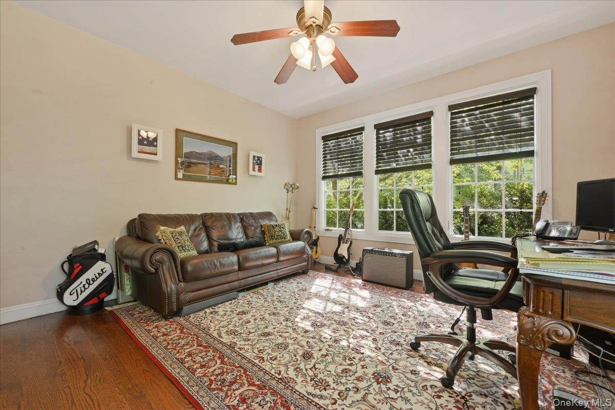 31 Cornwall Lane Sands Point, NY 11050 - Photo 24 of 49 a living room with furniture and a flat screen tv