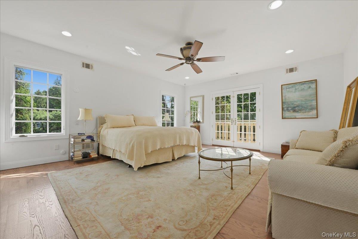 31 Cornwall Lane Sands Point, NY 11050 - Photo 27 of 49 a bedroom with a bed a table and chair