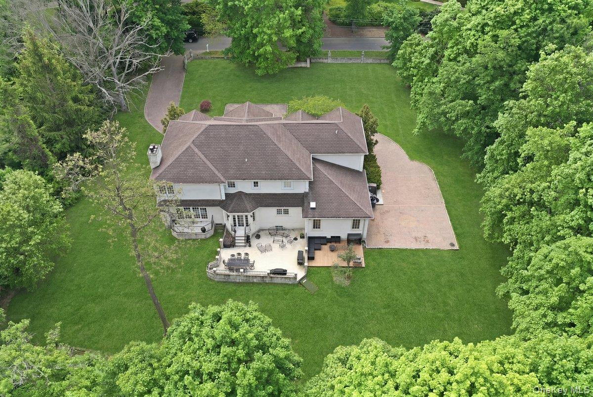 31 Cornwall Lane Sands Point, NY 11050 - Photo 45 of 49 an aerial view of a house with garden space and street view